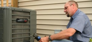 An expert servicing an AC unit